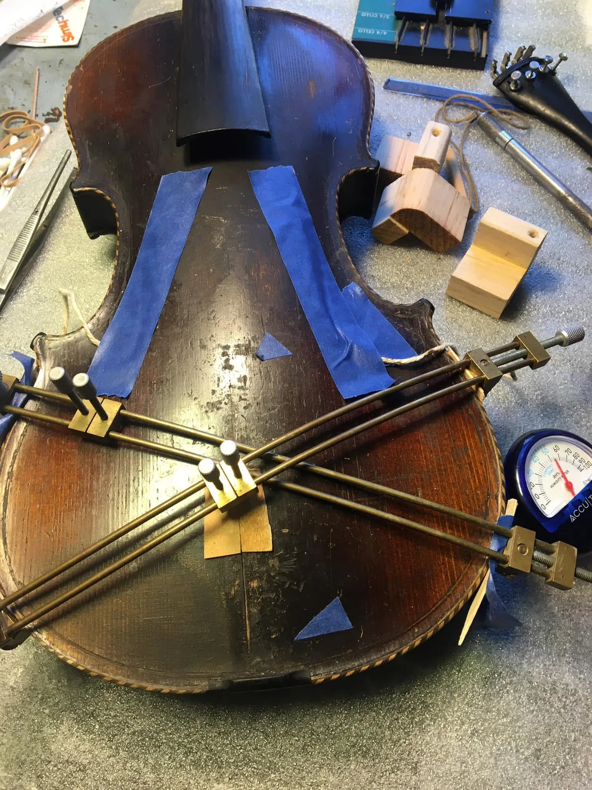 Violin secured with crossing clamps during a wood repair